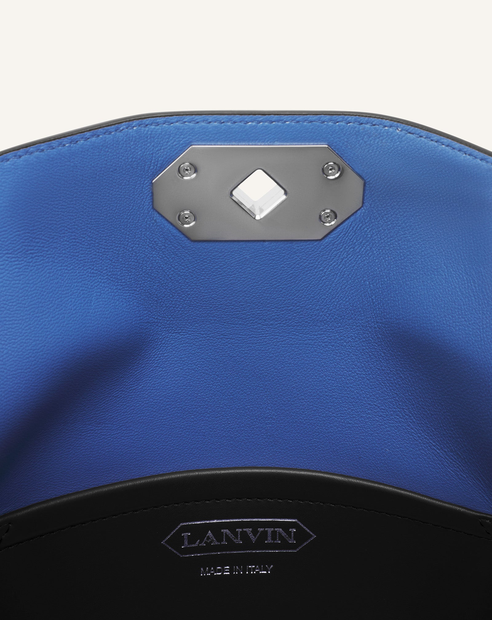 COMPAGNON ASYMMETRICAL LEATHER CLUTCH BAG