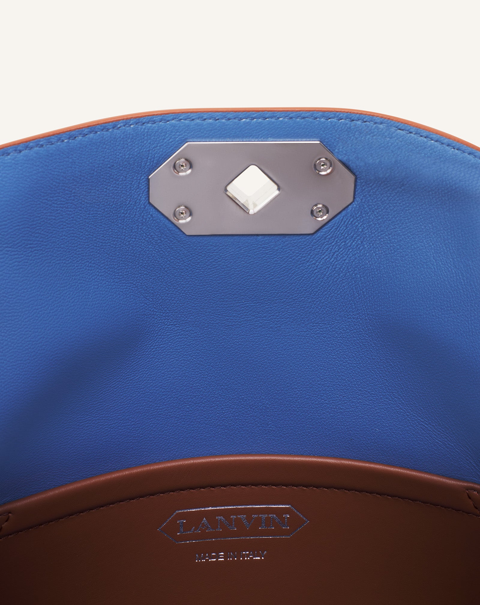 BROWN COMPAGNON ASYMMETRICAL LEATHER CLUTCH BAG